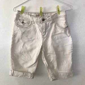 white shorts and white ripped jeans